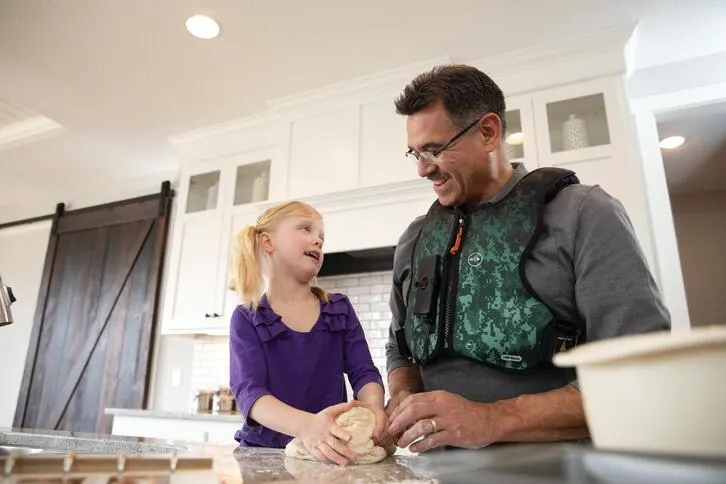Man wearing Monarch Vest in kitchen