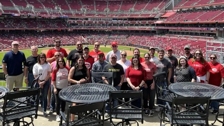 A group of Baxter employees at a baseball game
