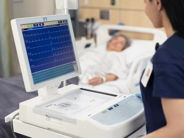 Healthcare profesional performing an ECG reading