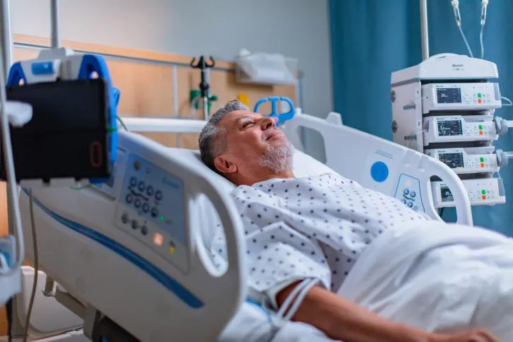 A med-surg patient lies in a Hillrom Centrella Smart+ Bed