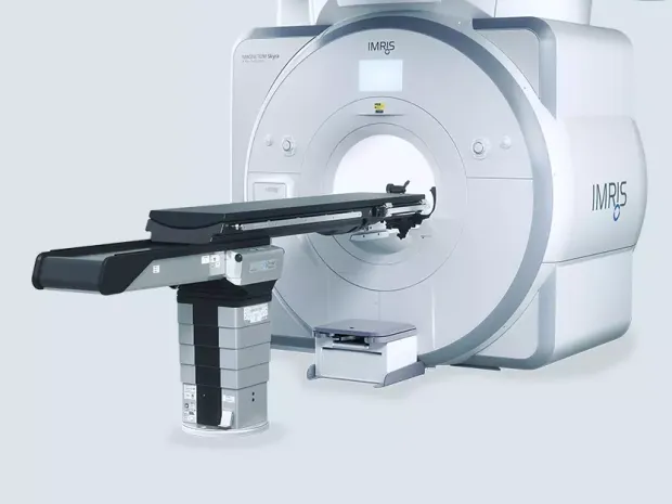 An MRI machine on a gray background.