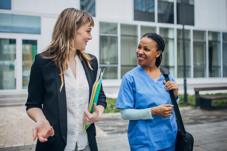 Baxter employee talking with nurse