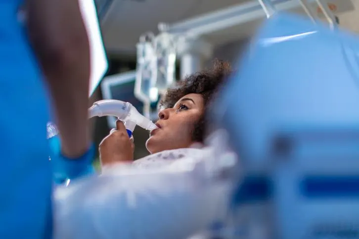 Patient receiving respiratory treatment