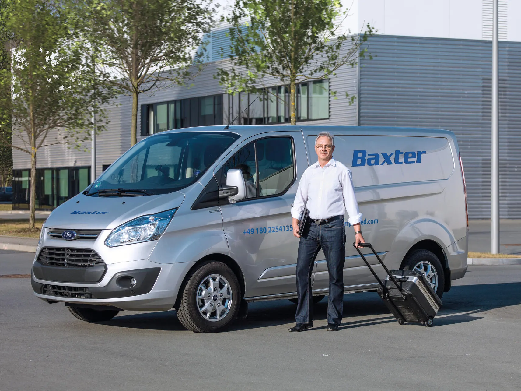 A service professional getting out of a Baxter truck