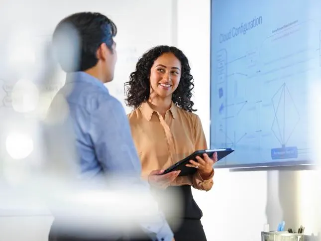 Technicians discuss a cloud configuration
