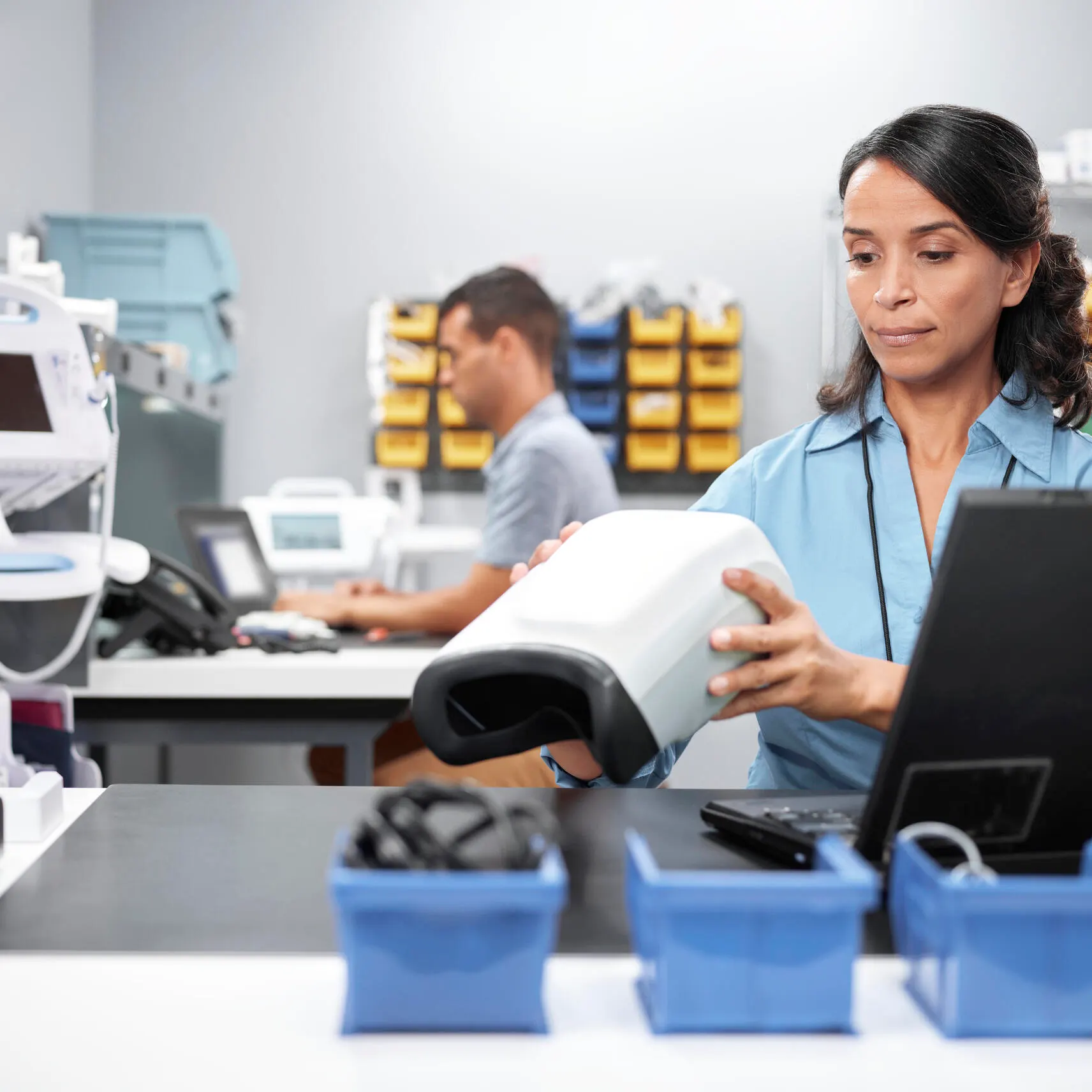 Service technician performs maintenance on a diagnostic device
