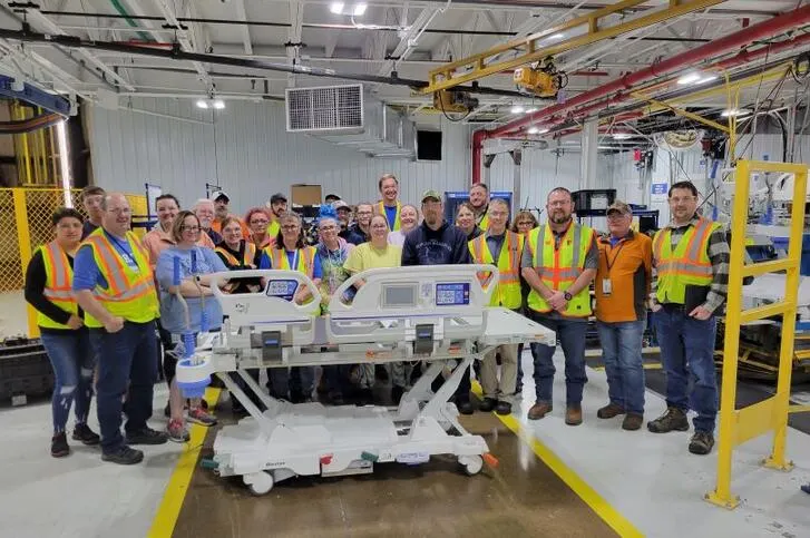 Manufacturing team standing in front of Baxter Centrella bed