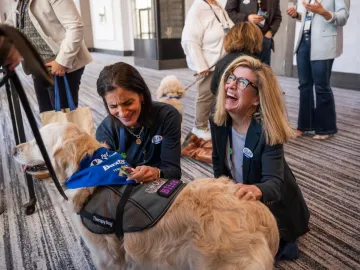 Baxter leaders petting Pet Partners therapy dog
