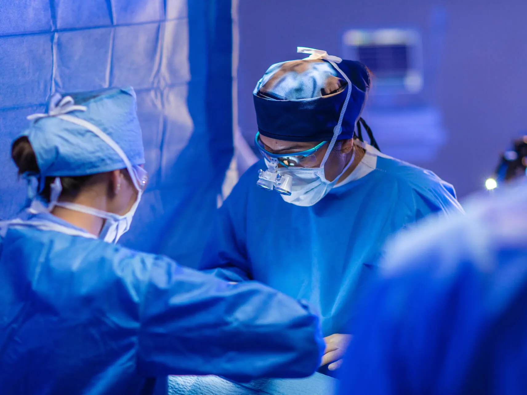 Health care profesionals performing surgery