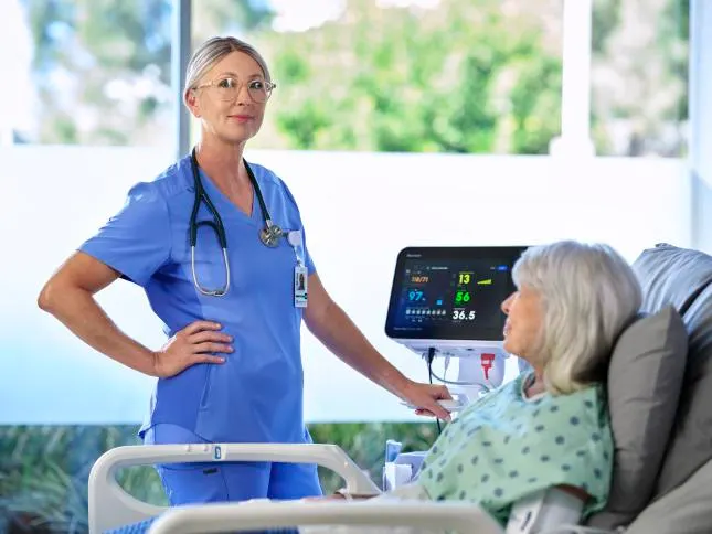 Healthcare worker poses with the Connex 360 and patient