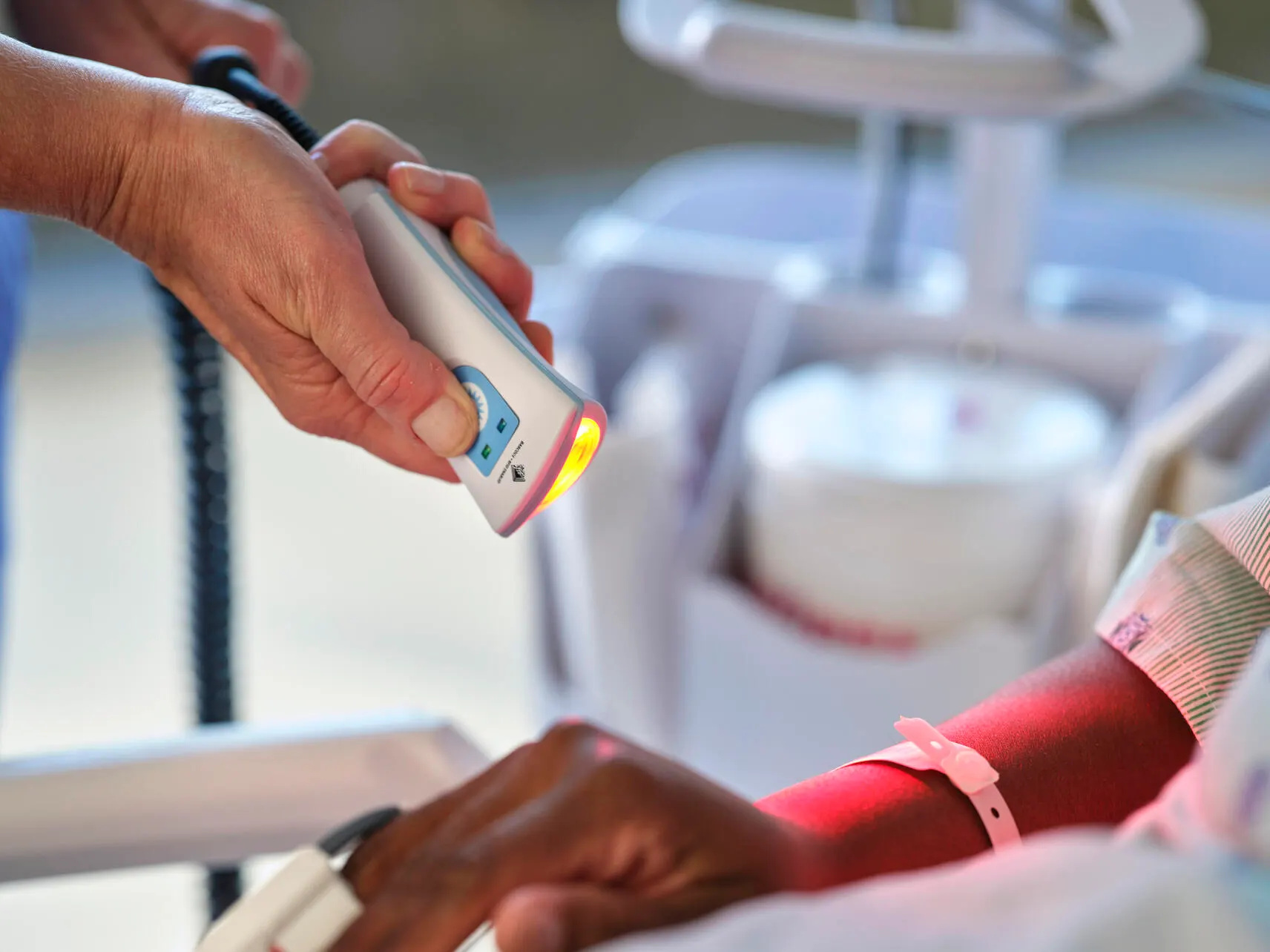 Nurse scanning patient wristband