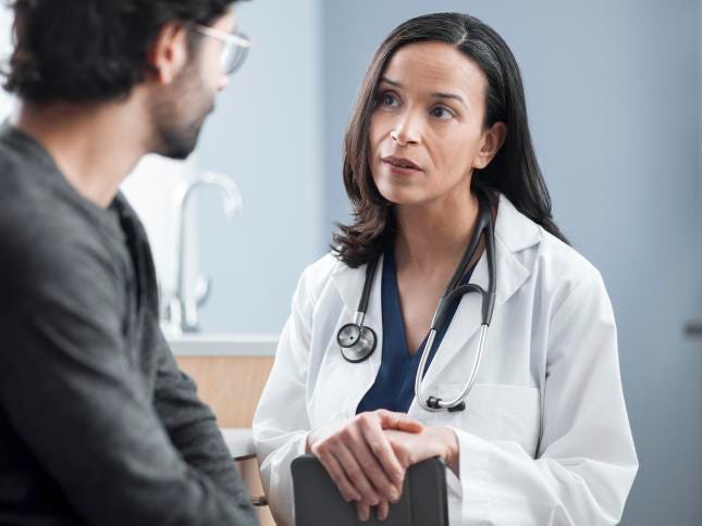 A physician and a patient in a primary care setting