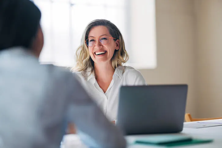 Baxter business woman collaborating with team