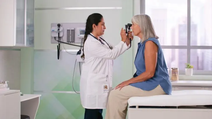 Healthcare profesional performing a check up with The Green Series 777 Integrated Wall System