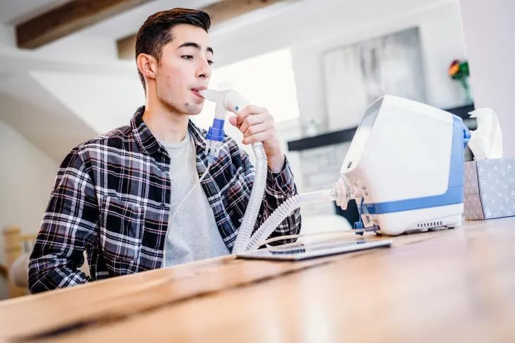 Young man using VOLARA System in home setting