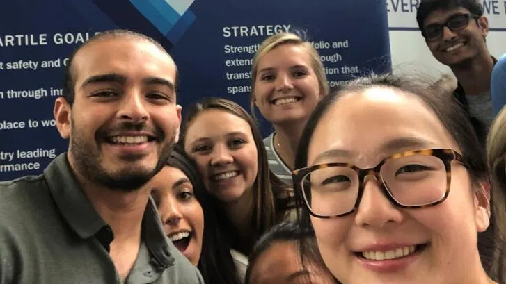 Group of happy Baxter employees