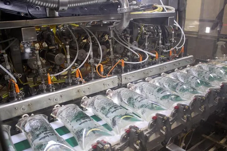 Saline bags being filled in a manufacturing plant