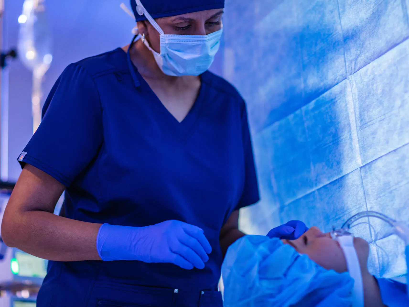 Surgeon looks at a patient on an operating table