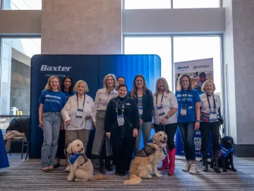 Baxter Global Philanthropy team with Pet Partners handlers and therapy dogs