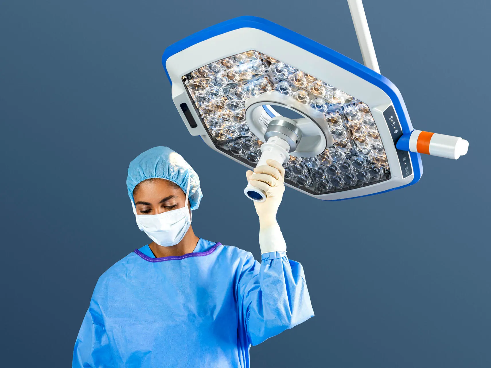 Clinician grasps sterile handle to adjust Helux Pro surgical light